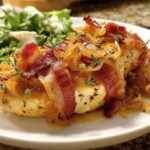 A delicious chicken breast topped with crispy bacon, caramelized onions, and fresh thyme, served with a side salad. This is a Dinner Recipes Recipe Everyone Asks For.