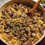 A creamy ground beef and mushroom pasta dish in a skillet, a perfect example of easy ground beef recipes.