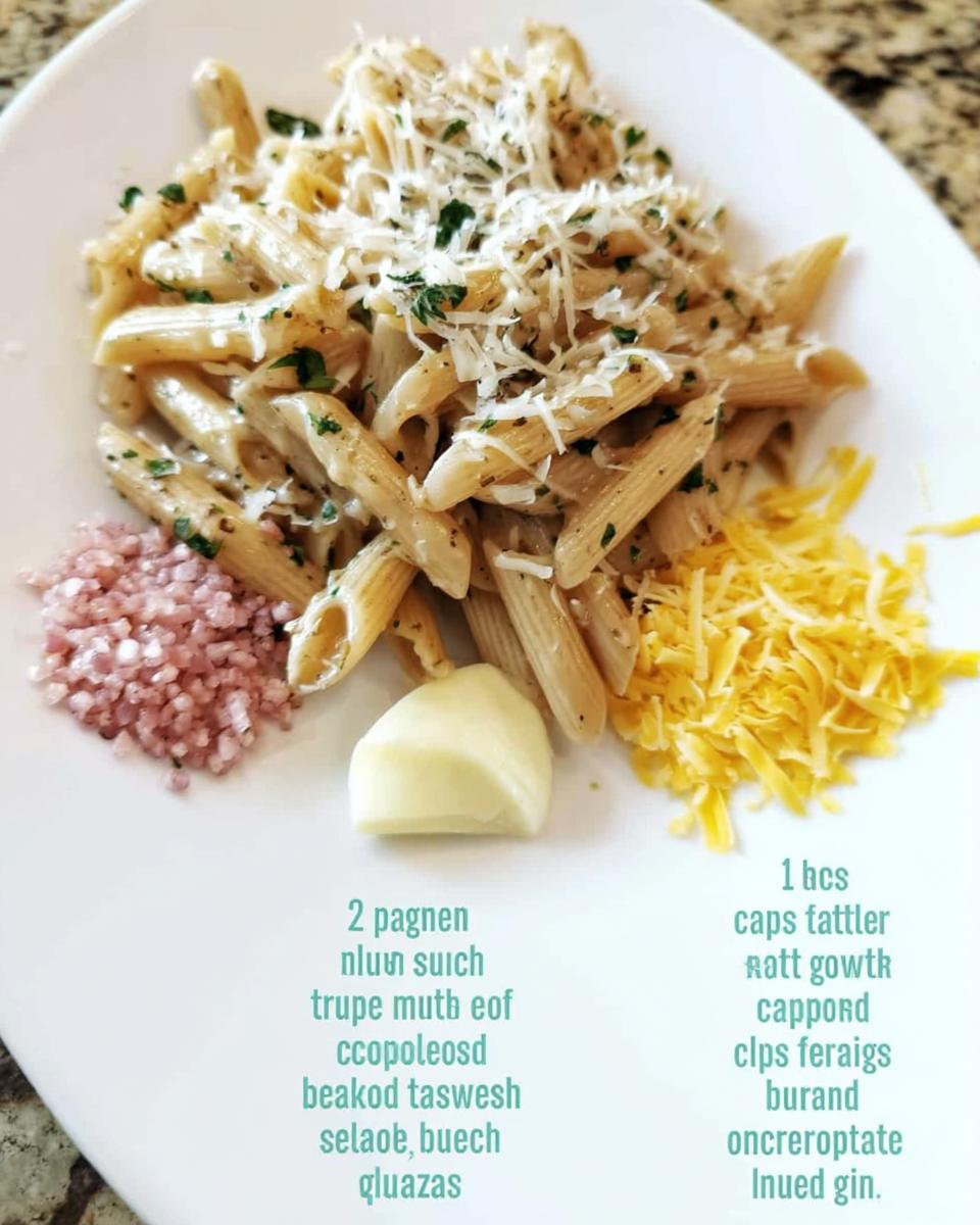 Penne pasta dish topped with grated cheese and parsley, served with a side of shredded cheese, pink salt, and a dollop of butter. Part of the Ultimate Pasta Recipes Guide.