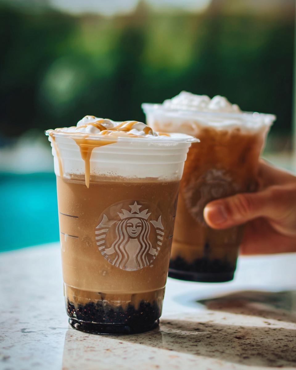 Two iced Starbucks drinks with whipped cream and caramel drizzle, showcasing the Best Starbucks Drinks 2025.