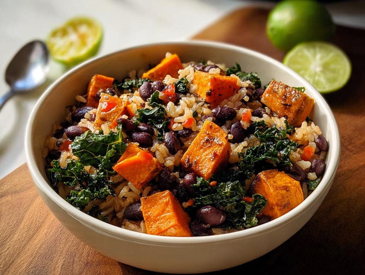 A vibrant bowl of rice, black beans, kale, and roasted sweet potato chunks, perfect for easy dinner recipes.