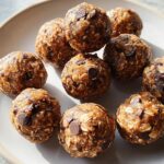 A plate of homemade chocolate chip energy bites, perfect for quick breakfast ideas.