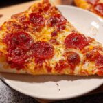 A delicious slice of pepperoni pizza, perfect for Pizza Night Recipes meal prep.