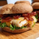 A juicy chicken bacon burger with melted cheese and fresh lettuce, perfect for restaurant-style easy dinner recipes at home.