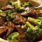 Close-up of tender slices of Chinese Beef and Broccoli coated in a rich, savory sauce.