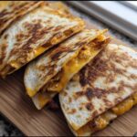 Golden-brown slices of High-Protein Chicken Ranch Quesadilla filled with melted cheese and chicken.