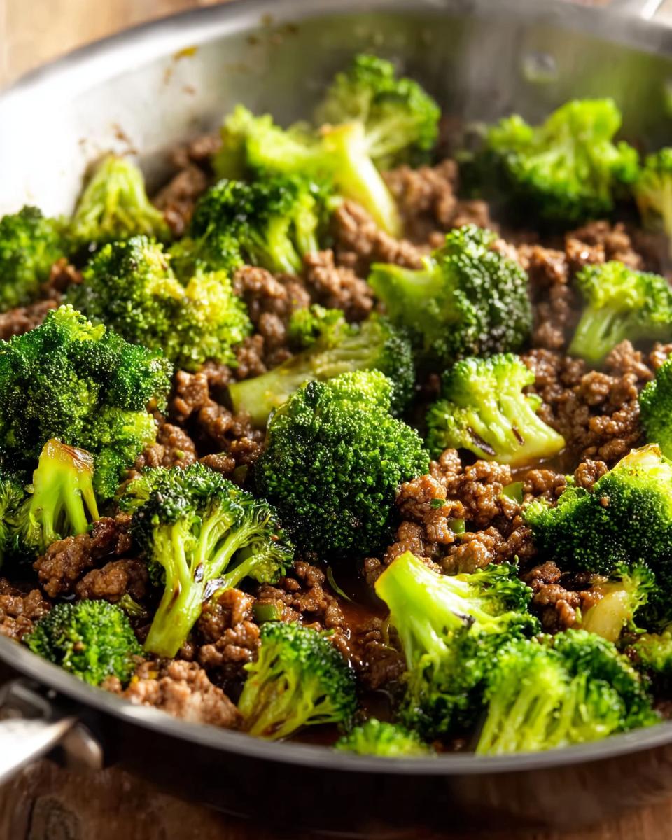 Close-up of a Keto Hamburger Broccoli Skillet, showing seasoned ground beef mixed with vibrant green broccoli florets in a pan.