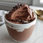 A decadent serving of High-Protein Cottage Cheese Peanut Butter Mousse topped with chocolate shavings.